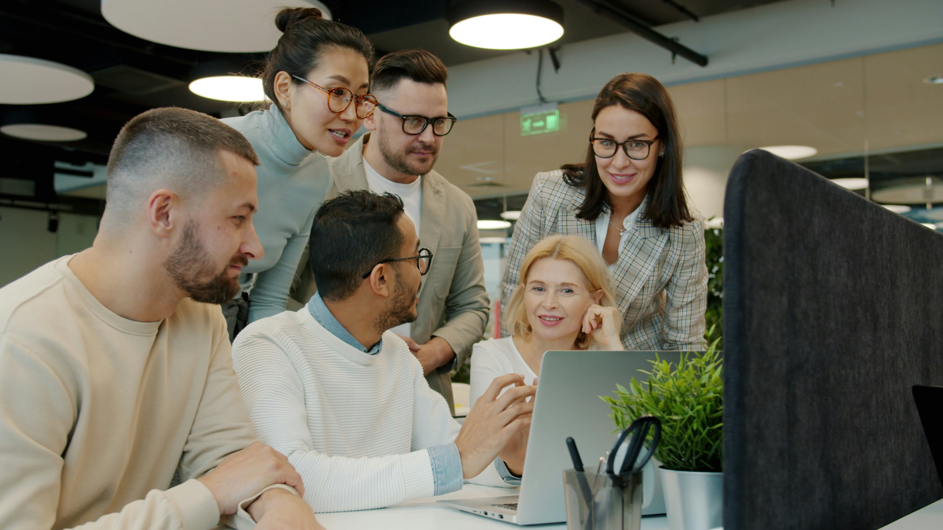 Oneroad team members standing together in office